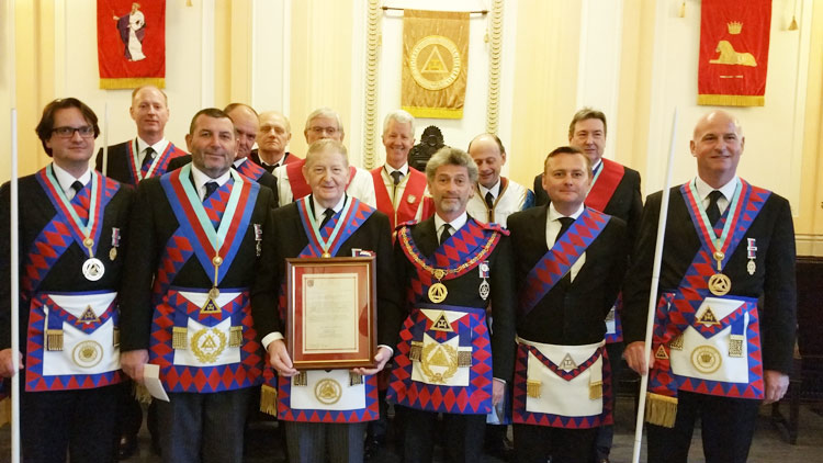 MetGInsp E.Comp Simon White presenting E.Comp Sid Goss with his Long Service Certificate